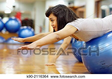 Picture - Asian women doing excercises on a gymnastic ball, Jakarta, Indonesia, Southeast Asia.. Fotosearch