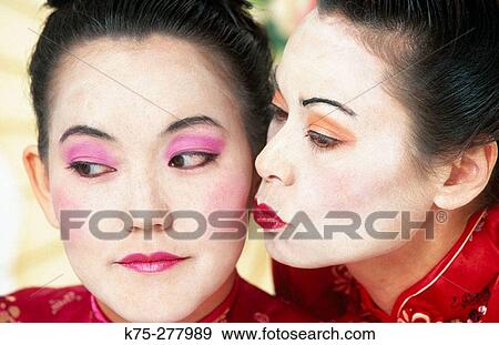 Asian women, traditional dress, kiss View Large Photo Image Stock Photo - Asian women, traditional dress, kiss. Fotosearch