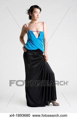 Asian young female posing full body against white background View Large Photo Image Stock Image - Asian young female posing full body against white background. Fotosearch