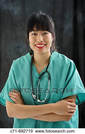Stock Photo - Asian/Chinese doctor/surgeon in scrubs. Fotosearch