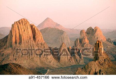 Stock Photograph - Assekrem Pass in the Atakor Massif, where priest Charles de Foucault used to stay in an ermitage in 1911. Hoggar Mountains. Sahara. Algeria.. Fotosearch
