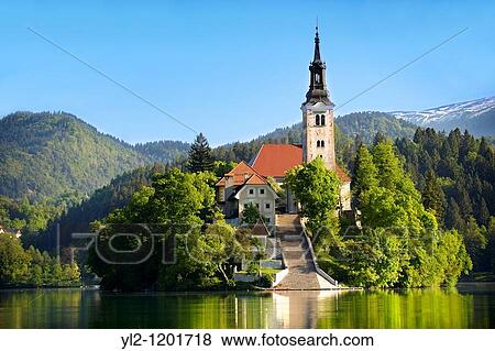 Stock Photo - Assumption of Mary Pilgrimage Church in the middle of Lake Bled Slovenia. Fotosearch