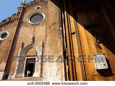 At left Basilica di Santa Maria Gloriosa dei Frari, usually just called the Frari, is a church, Campo dei Frari, San Polo district, Venice, Veneto, Italy, Europe. View Large Photo Image Stock Photo - At left Basilica di Santa Maria Gloriosa dei Frari, usually just called the Frari, is a church, Campo dei Frari, San Polo district, Venice, Veneto, Italy, Europe.. Fotosearch