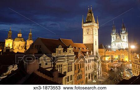 Stock Image - At left St Nicholas church, Old Town Hall, on background Church of Mother of God before Tyn or Church of Our Lady before Tyn, Old Town Square, Staromestske namesti, Prague, Czech Republic Europe.. Fotosearch