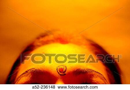 Stock Photo - At sign on forehead. Fotosearch