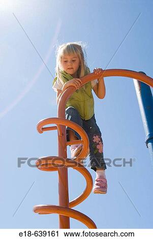 At the playground. 4 year old girl. White Rock, BC Canada View Large Photo Image Stock Image - At the playground. 4 year old girl. White Rock, BC Canada. Fotosearch