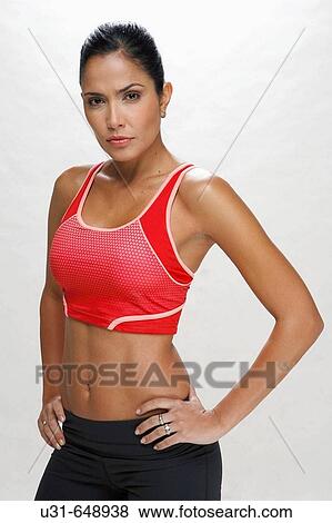 Stock Photo - Athletic Latin girl looking tough at the camera. Fotosearch
