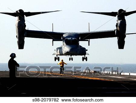 Stock Image - ATLANTIC OCEAN (Oct. 18, 2010) An MV-22B Osprey assigned to Marine Medium Tiltrotor Squadron (VMM) 263 lands aboard the multipurpose amphibious assault ship USS Bataan (LHD 5). Bataan is underway conducting landing qualifications.. Fotosearch