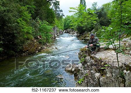 Stock Photo - Atlantic salmon fishermen, Puenteviesgo, Pas River, Cantabria, Spain. Fotosearch
