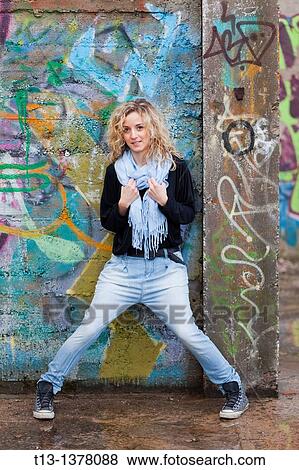 Attractive adult girl before a colorful wall View Large Photo Image Stock Photo - Attractive adult girl before a colorful wall. Fotosearch