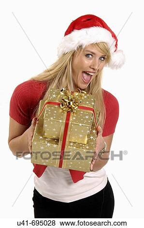 Attractive Blonde female with Xmas presents View Large Photo Image Stock Photo - Attractive Blonde female with Xmas presents. Fotosearch