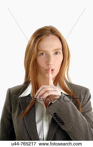 Stock Photo - Attractive Businesswoman asking for silence. Fotosearch
