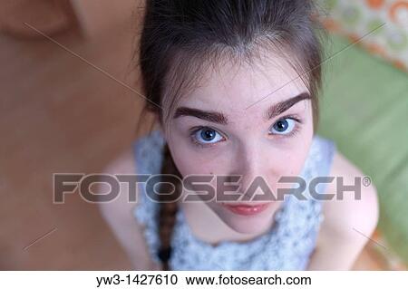 Attractive funny blond with braid women posing in a room View Large Photo Image Stock Image - Attractive funny blond with braid women posing in a room. Fotosearch