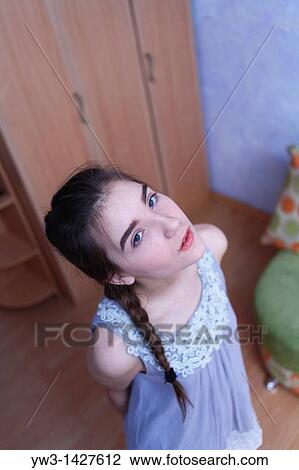 Attractive funny blond with braid women posing in a room View Large Photo Image Stock Image - Attractive funny blond with braid women posing in a room. Fotosearch