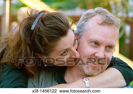 Attractive loving middle aged couple having a romantic moment age 43 St Paul Minnesota MN USA View Large Photo Image Stock Image - Attractive loving middle aged couple having a romantic moment age 43 St Paul Minnesota MN USA. Fotosearch
