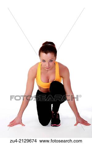 Picture - Attractive slim female model exercising.. Fotosearch