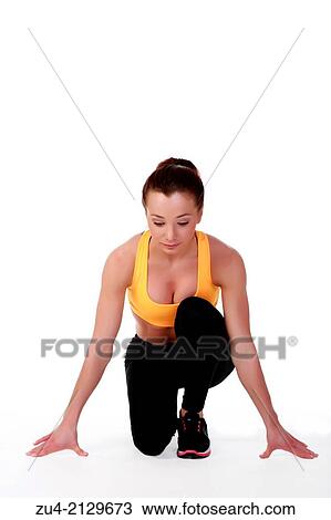 Stock Image - Attractive slim female model exercising.. Fotosearch