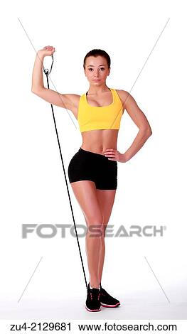 Stock Image - Attractive slim female model exercising.. Fotosearch