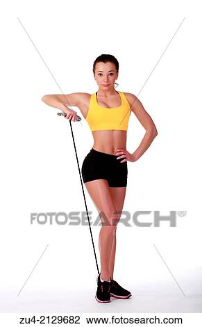 Attractive slim female model exercising. View Large Photo Image Stock Image - Attractive slim female model exercising.. Fotosearch