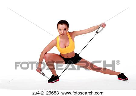 Stock Image - Attractive slim female model exercising.. Fotosearch