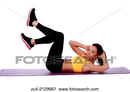 Stock Photo - Attractive slim female model exercising.. Fotosearch