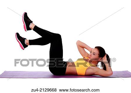 Attractive slim female model exercising. View Large Photo Image Stock Photo - Attractive slim female model exercising.. Fotosearch