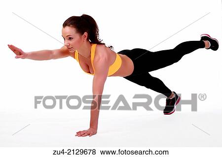 Attractive slim female model exercising. View Large Photo Image Stock Photo - Attractive slim female model exercising.. Fotosearch