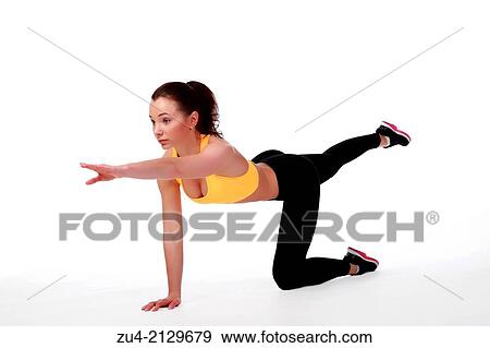 Attractive slim female model exercising. View Large Photo Image Stock Photo - Attractive slim female model exercising.. Fotosearch