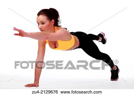 Stock Photograph - Attractive slim female model exercising.. Fotosearch
