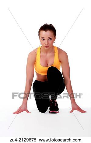 Attractive slim female model exercising. View Large Photo Image Stock Photography - Attractive slim female model exercising.. Fotosearch