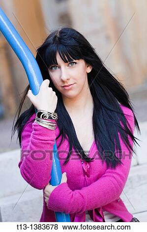 Attractive woman in a Violet clothing portrait View Large Photo Image Stock Photo - Attractive woman in a Violet clothing portrait. Fotosearch