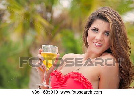 Attractive woman in bikini with sparkling cocktail drink View Large Photo Image Stock Image - Attractive woman in bikini with sparkling cocktail drink. Fotosearch