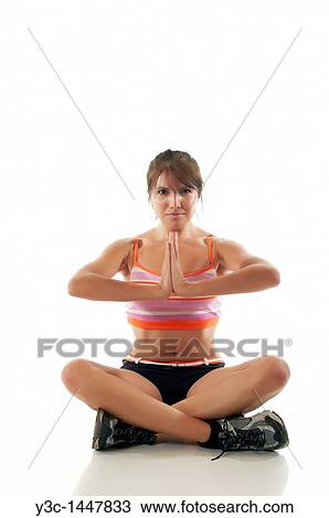 Attractive woman meditating with yoga View Large Photo Image Stock Image - Attractive woman meditating with yoga. Fotosearch