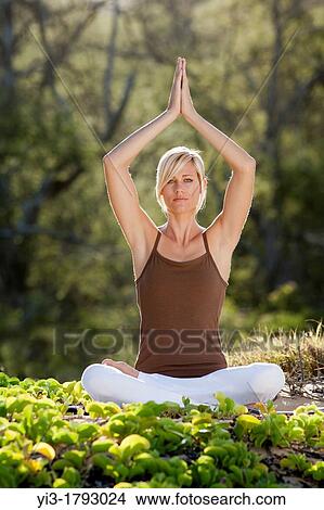 Attractive woman practices yoga at Makena, Maui, Hawaii View Large Photo Image Picture - Attractive woman practices yoga at Makena, Maui, Hawaii. Fotosearch