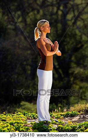 Attractive woman practices yoga at Makena, Maui, Hawaii View Large Photo Image Stock Image - Attractive woman practices yoga at Makena, Maui, Hawaii. Fotosearch
