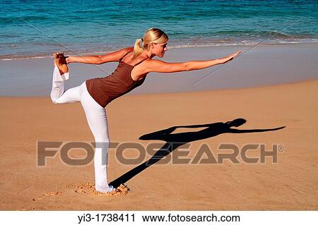 Attractive woman practices yoga at Makena, Maui, Hawaii View Large Photo Image Stock Image - Attractive woman practices yoga at Makena, Maui, Hawaii. Fotosearch
