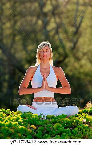 Attractive woman practices yoga at Makena, Maui, Hawaii View Large Photo Image Stock Image - Attractive woman practices yoga at Makena, Maui, Hawaii. Fotosearch