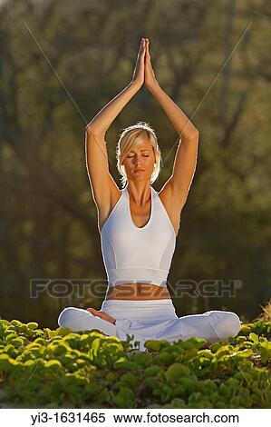 Attractive woman practices yoga at Makena, Maui, Hawaii View Large Photo Image Stock Photography - Attractive woman practices yoga at Makena, Maui, Hawaii. Fotosearch