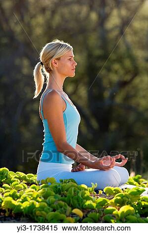 Attractive woman practices yoga at Makena, Maui, Hawaii View Large Photo Image Stock Photography - Attractive woman practices yoga at Makena, Maui, Hawaii. Fotosearch