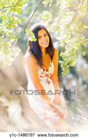 Attractive woman very happy in the woods View Large Photo Image Stock Photo - Attractive woman very happy in the woods. Fotosearch
