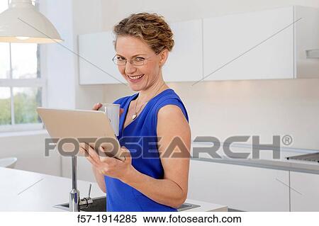 Attractive young businesswoman preparing to go to work View Large Photo Image Stock Photography - Attractive young businesswoman preparing to go to work. Fotosearch