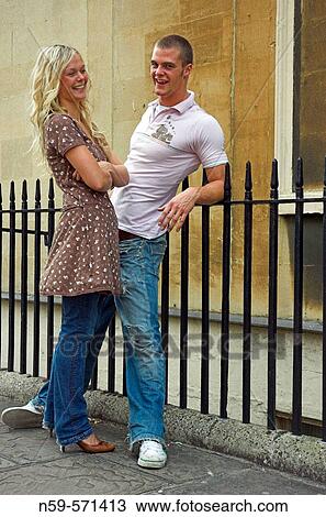 Attractive young couple sharing a joke in the street View Large Photo Image Stock Image - Attractive young couple sharing a joke in the street. Fotosearch