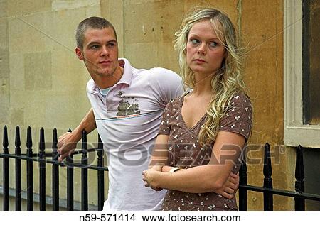 Attractive young couple with relationship problems and struggling to communicate. View Large Photo Image Picture - Attractive young couple with relationship problems and struggling to communicate.. Fotosearch