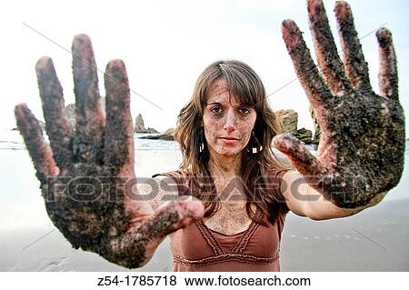 Attractive young Woman at El Sabl? n beach, with sand in her face and hands, Asturias, Spain View Large Photo Image Stock Photo - Attractive young Woman at El Sabl? n beach, with sand in her face and hands, Asturias, Spain. Fotosearch