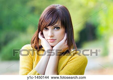 Attractive young woman calm portrait head and shoulders View Large Photo Image Picture - Attractive young woman calm portrait head and shoulders. Fotosearch