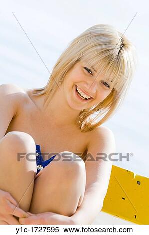 Stock Photography - Attractive young woman cheerful. Fotosearch