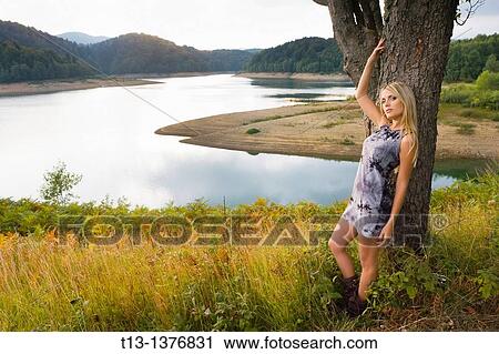 Attractive young woman in nature View Large Photo Image Stock Image - Attractive young woman in nature. Fotosearch