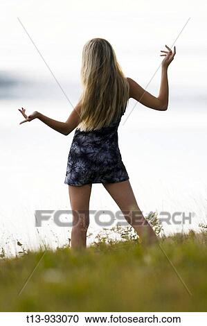 Attractive young woman in nature View Large Photo Image Stock Image - Attractive young woman in nature. Fotosearch