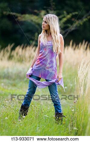Stock Image - Attractive young woman in nature. Fotosearch