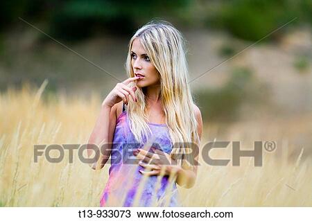 Attractive young woman in nature View Large Photo Image Stock Image - Attractive young woman in nature. Fotosearch